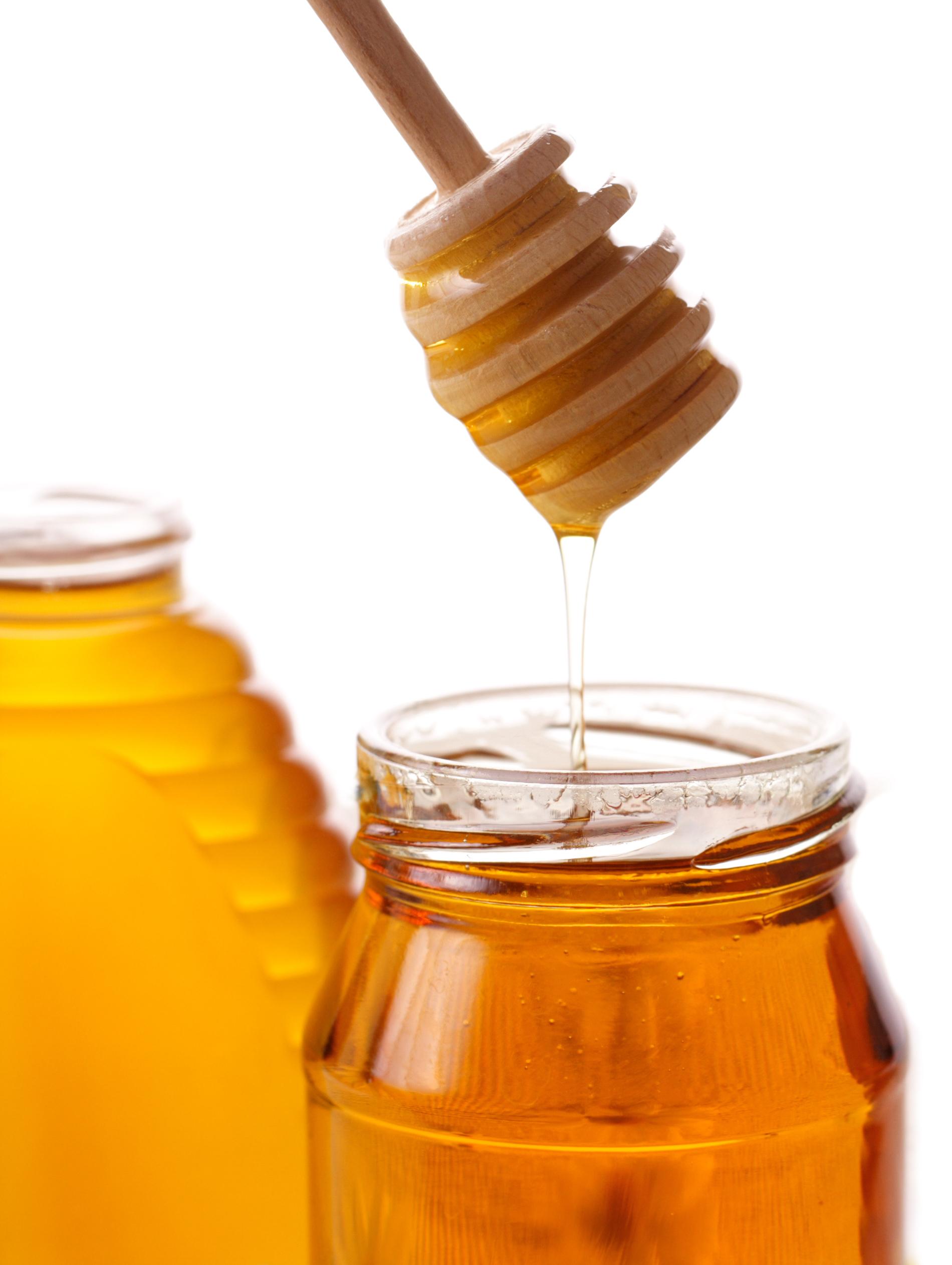 Honey in a Jar with a honey ladle